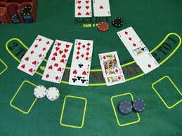 Live baccarat table showing banker and player hands with active betting interface